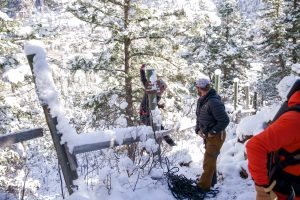 Slacklining crew hangs out in the snow